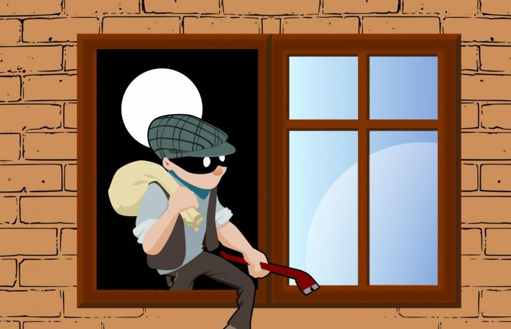 ladrón robando en una ventana