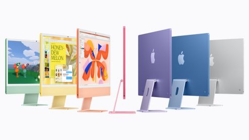 Siete ordenadores iMac vistos desde distintos ángulos que muestran su variedad cromática, incluyendo verde, amarillo, naranja, rosa, morado, azul y plata.