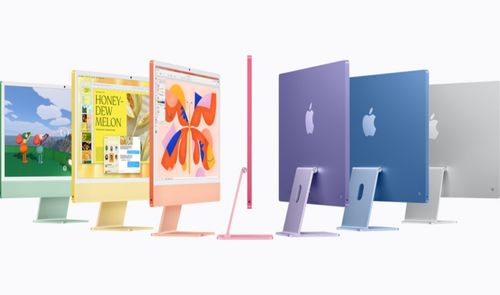 Siete ordenadores iMac vistos desde distintos ángulos que muestran su variedad cromática, incluyendo verde, amarillo, naranja, rosa, morado, azul y plata.