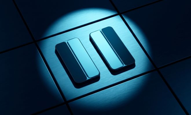 Icono metálico de pausa iluminado por un foco sobre una superficie cuadriculada azul.